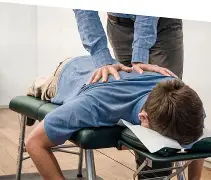 Dr. Bell adjusting a patient